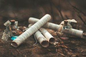wrapped scrolls of paper on a rock