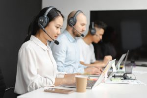 2 people taking customer service calls