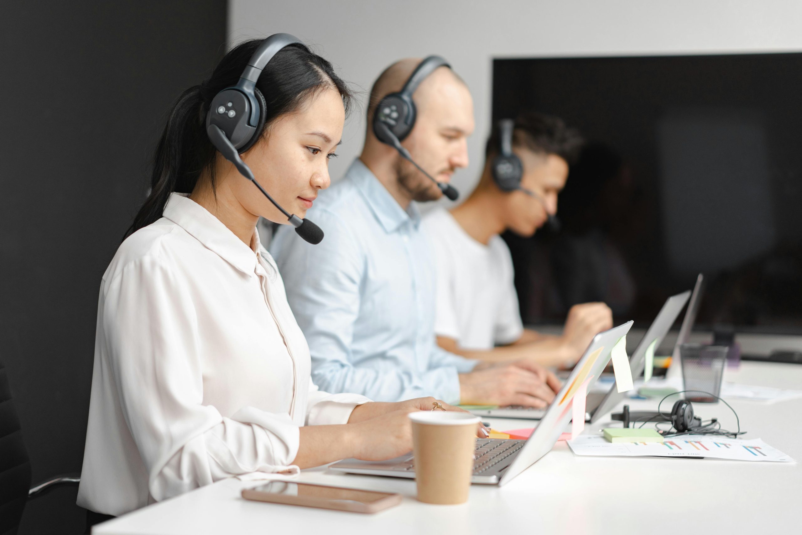 2 people taking customer service calls