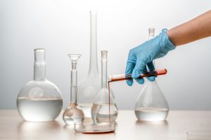 lab beakers with tech running experiment