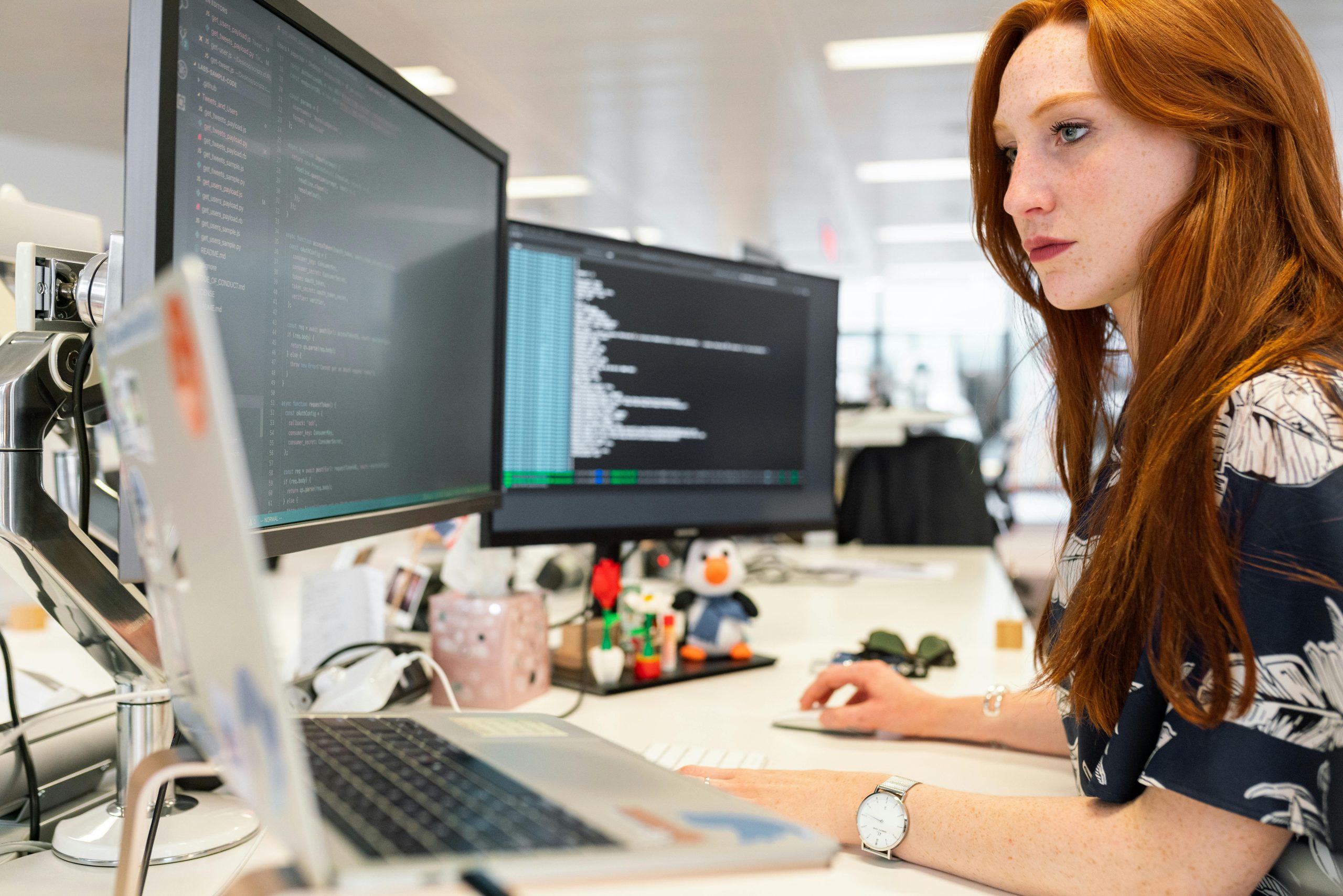 woman working with multiple screens
