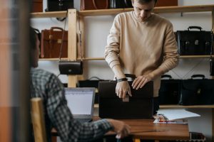 man opening portfolio briefcase
