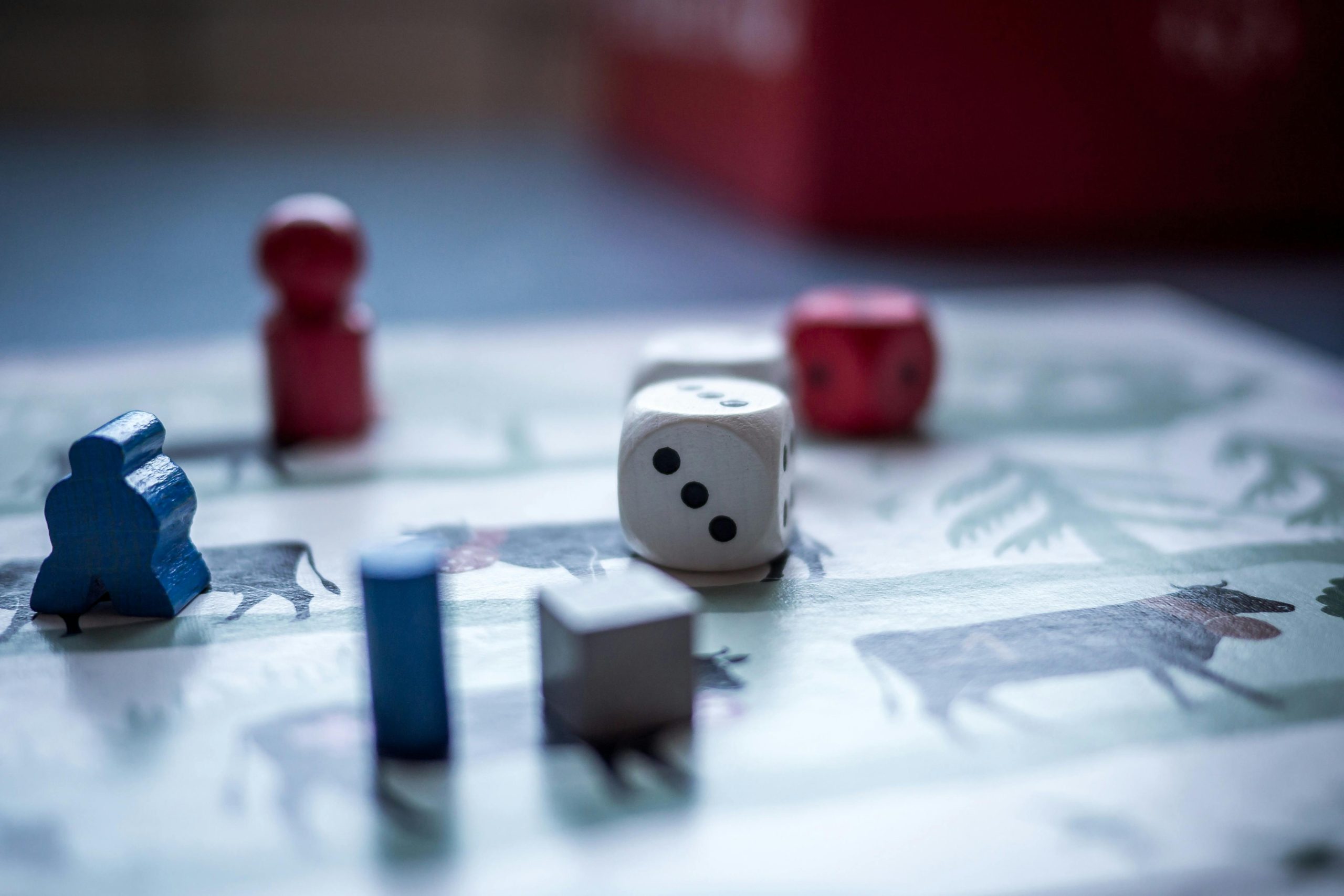 close up of board game with pieces and dice