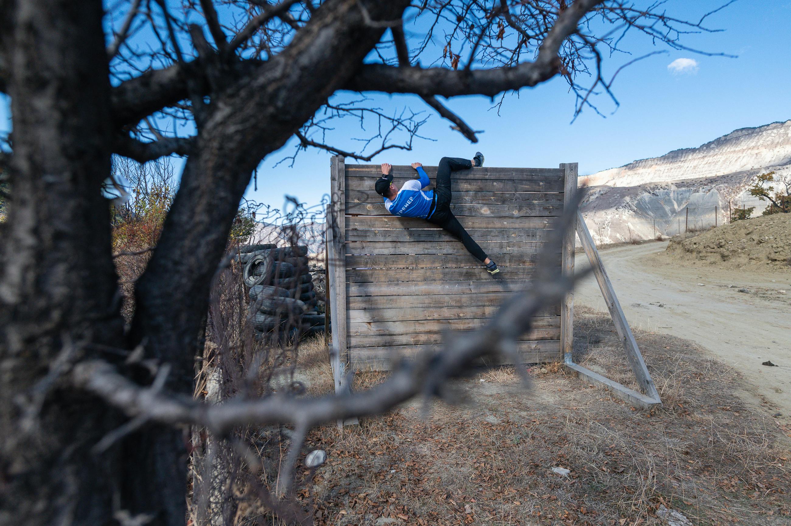 scaling a wall obstacle